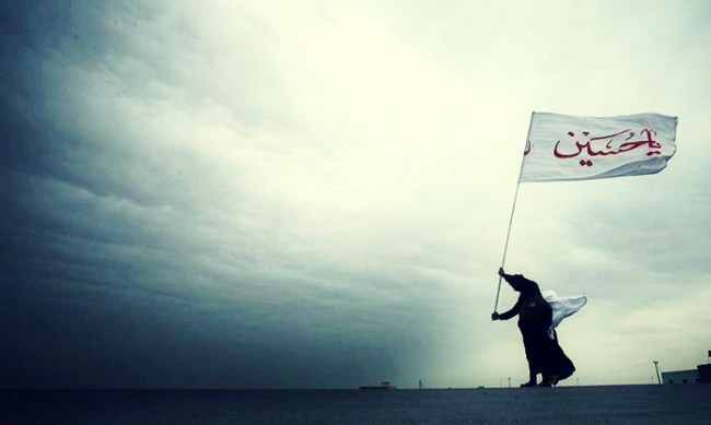 Man Raises A "Ya Hussain" Flag